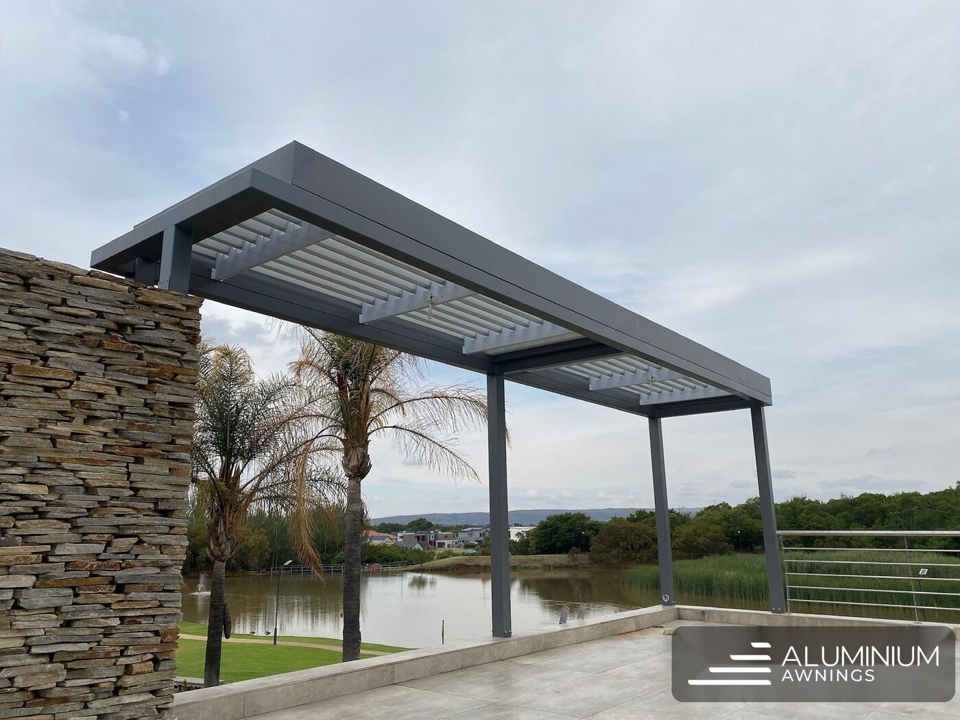 Aluminium louvre pergola over an estate terrace, Western Cape