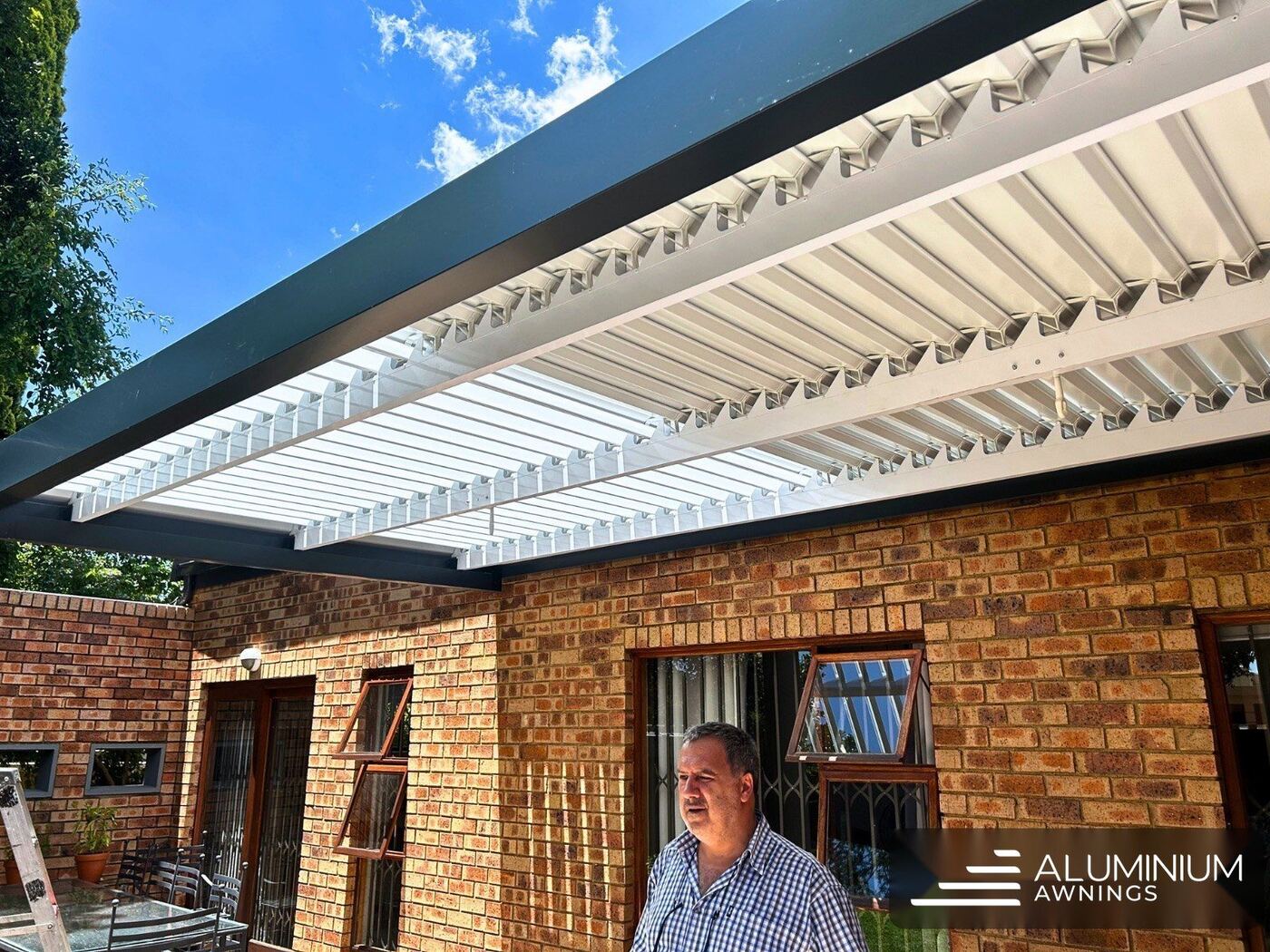 Aluminium louvre system with charcoal frame and louvre panels — Bellville, Cape Town Northern Suburbs