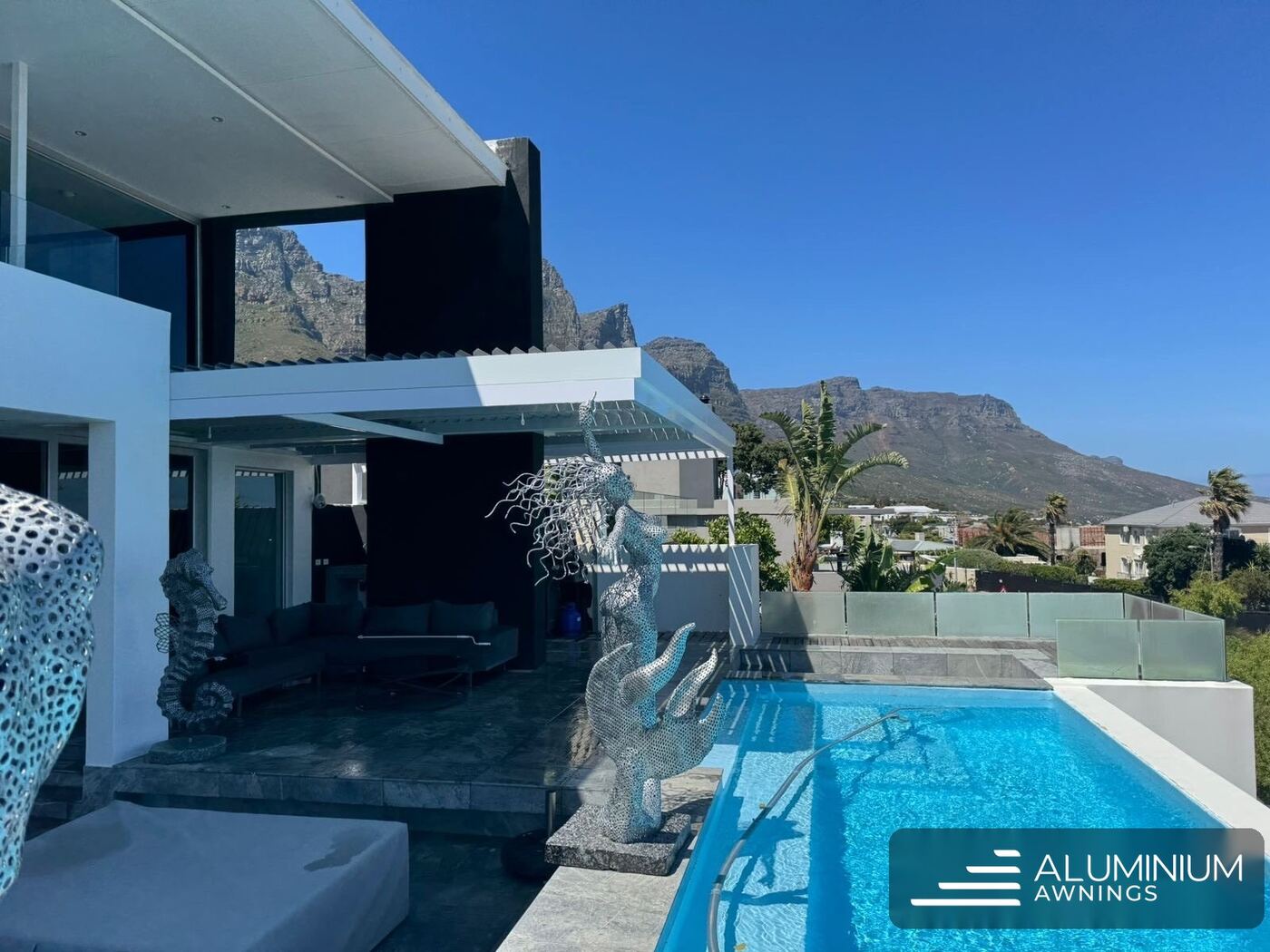 Dove grey cantilevered louvre roof camps bay