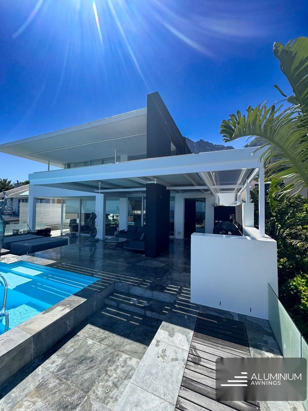 Dove grey cantilevered louvre roof camps bay